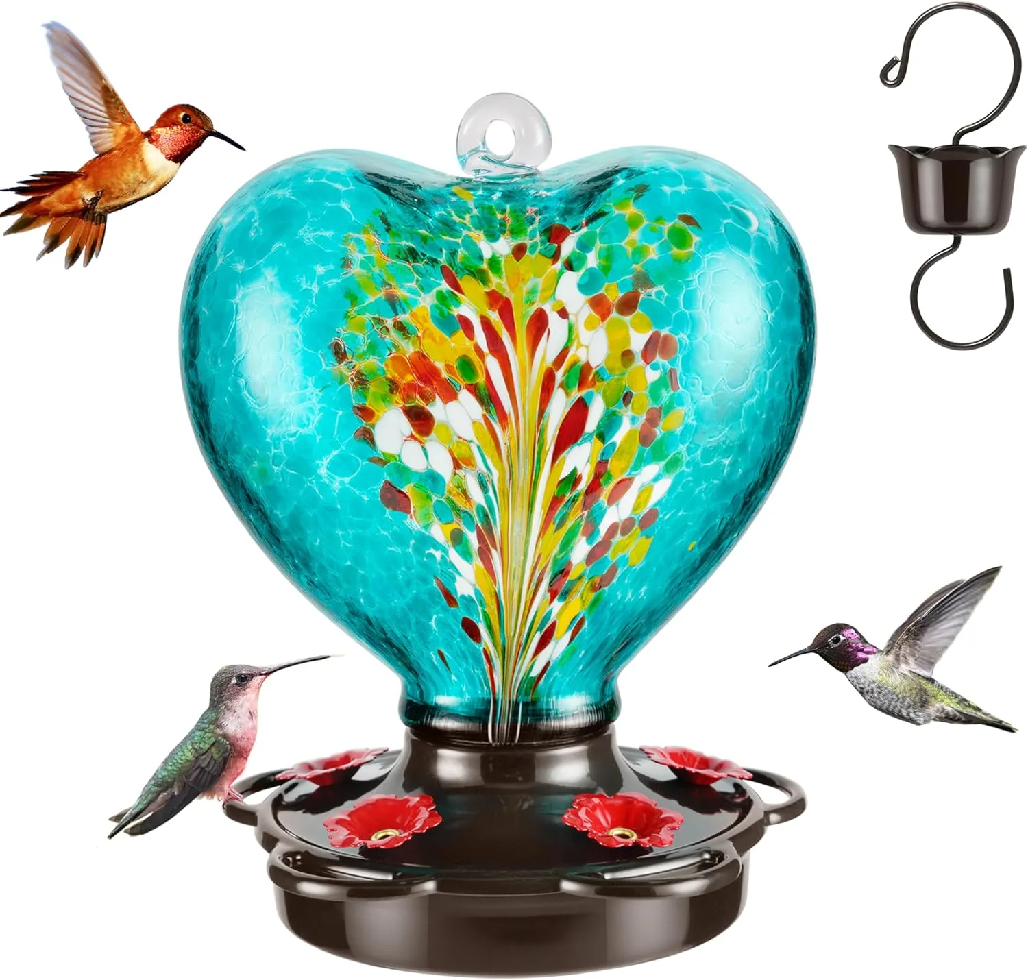 Teal heart-shaped hummingbird feeder with Phoenix tail design hanging outdoors, surrounded by greenery, attracting birds with vibrant colors and a built-in ant moat.