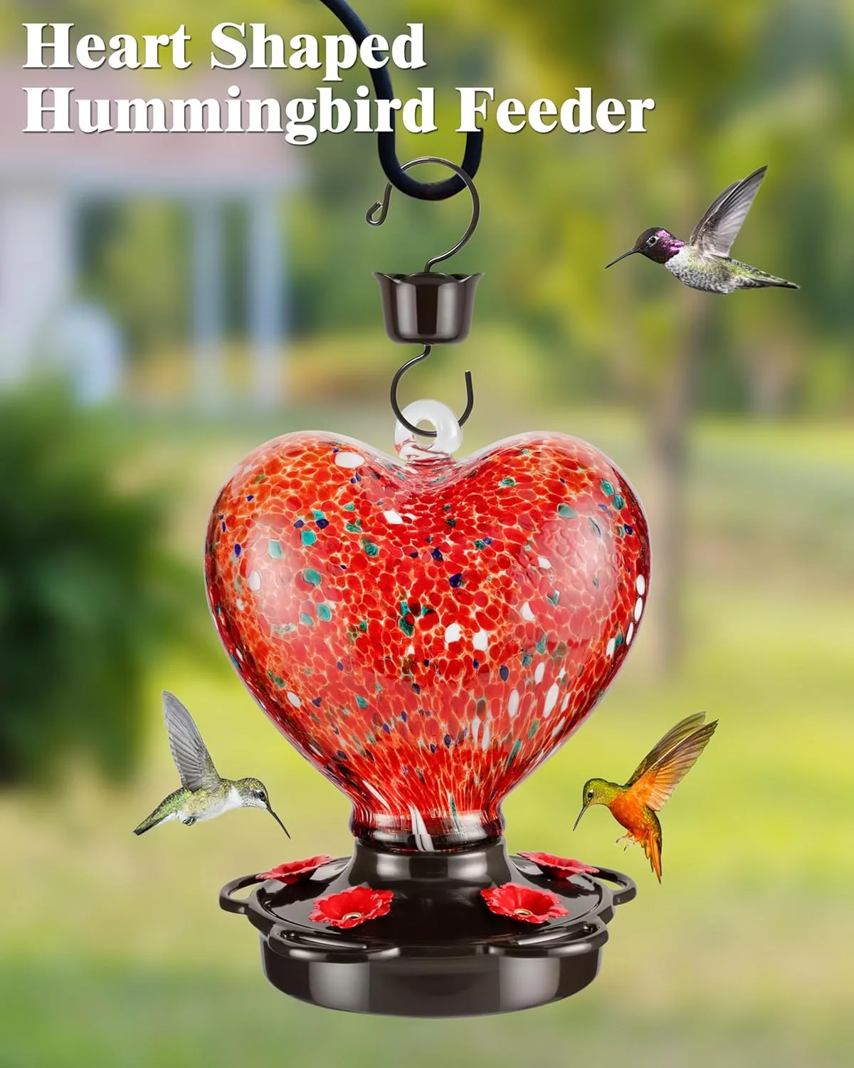 Heart-shaped red hummingbird feeder for outdoor use, showcasing a generous 28 fl. oz capacity. Crafted with a rust-proof metal cover and leak-proof base to prevent spills. Perfect for inviting hummingbirds to your garden with its eye-catching design.